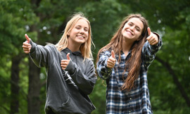 smiling girls in the forest