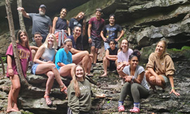 A group o fkids on rocks