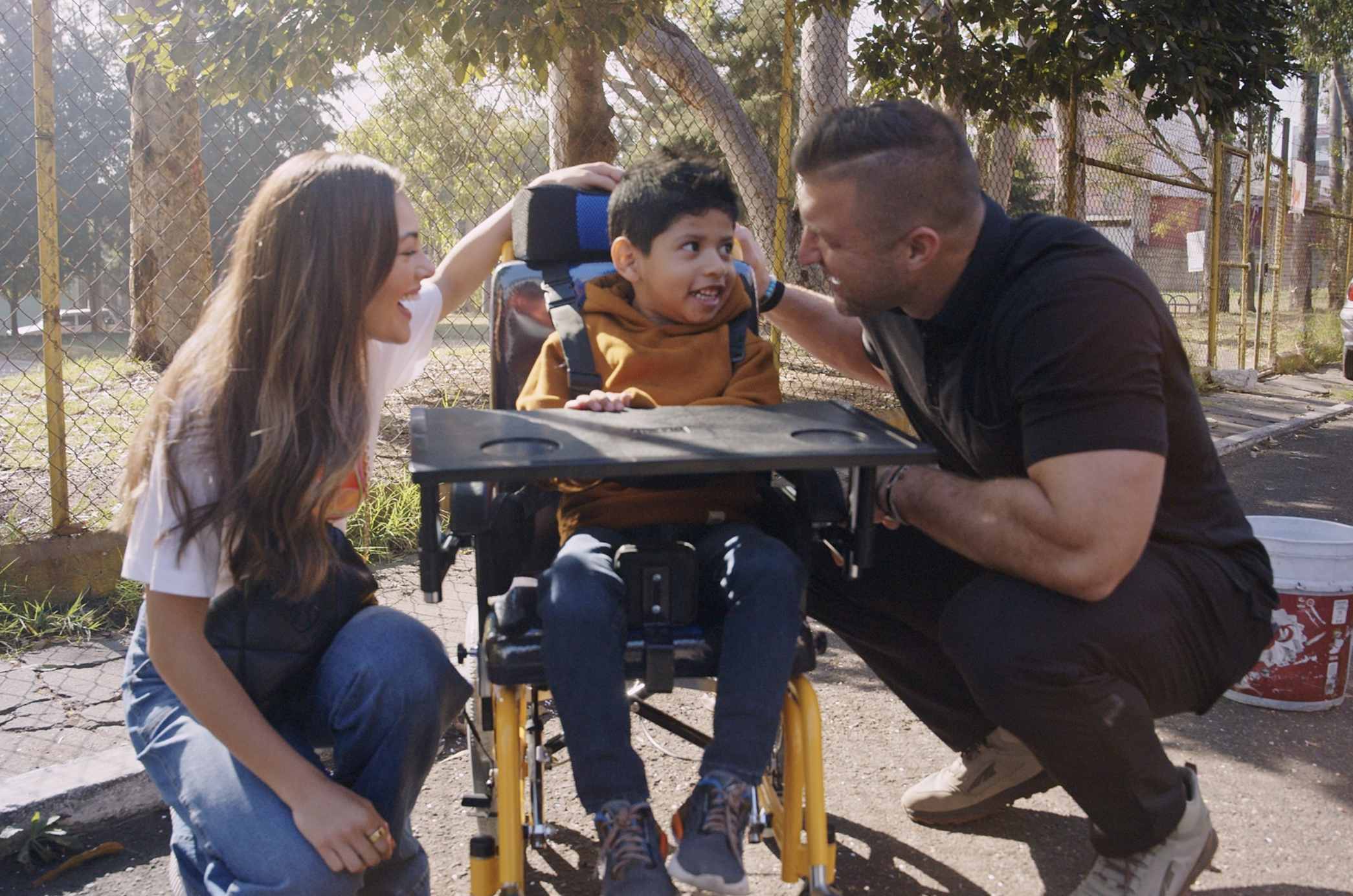 Tim Demi Sebastian wheelchair photo.png